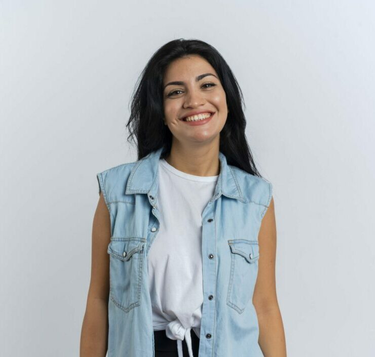 smiling young caucasian girl looks at camera isolated on white background with copy space